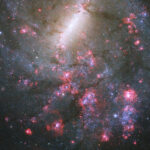 A rosy barred spiral galaxy image