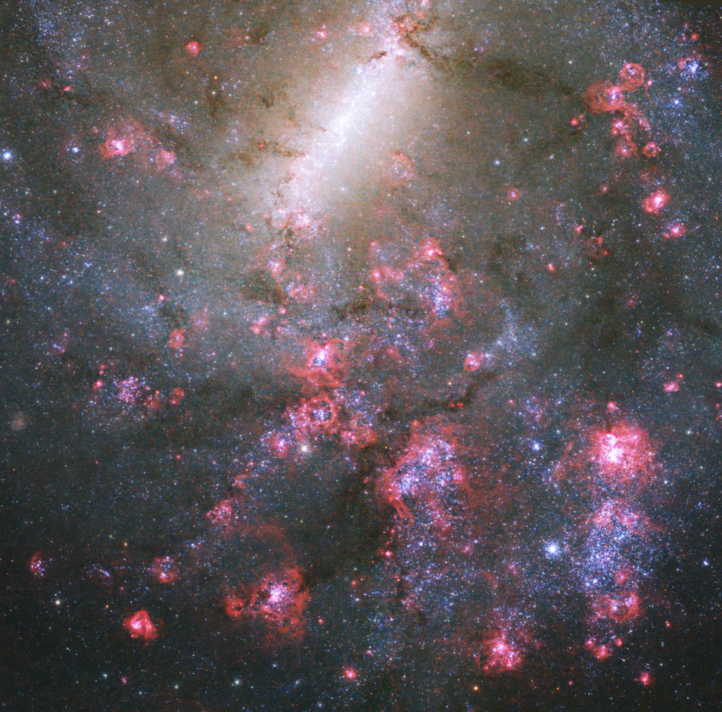 A rosy barred spiral galaxy image