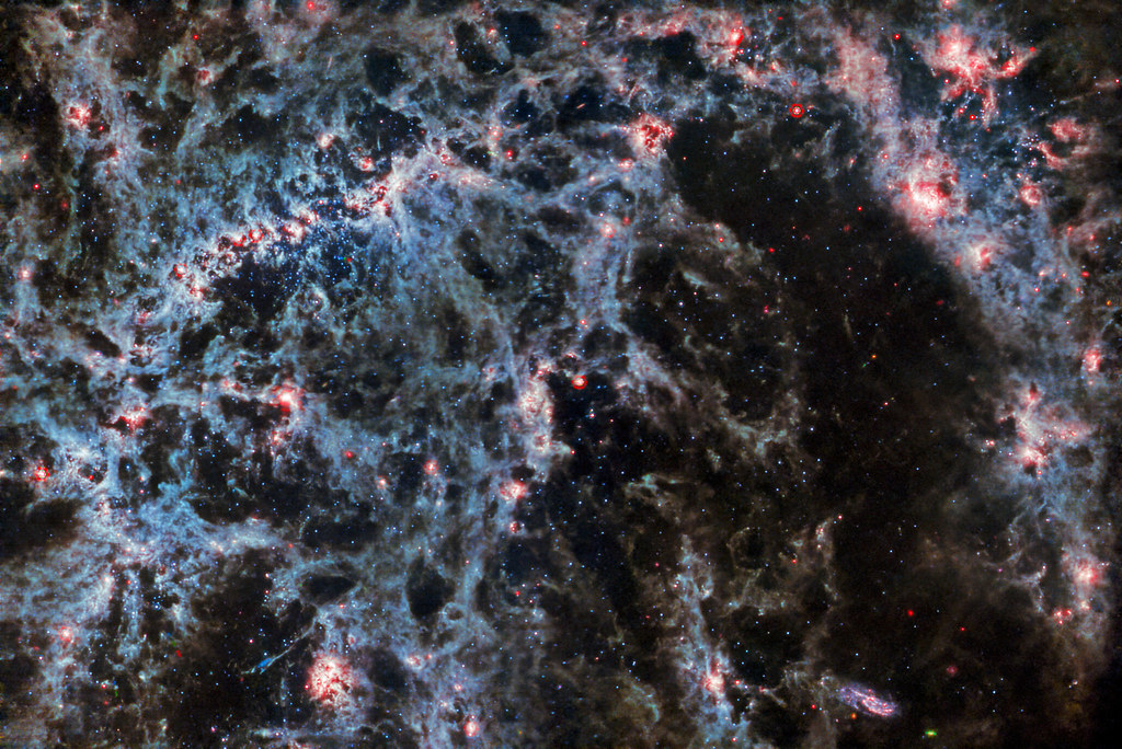 Webb Peers Behind the Bars of NGC 5068 (MIRI Version) image